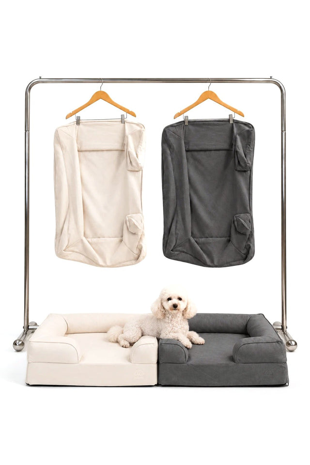 Kumo beds in Cream and Charcoal Gray with their spare covers, and a white poodle