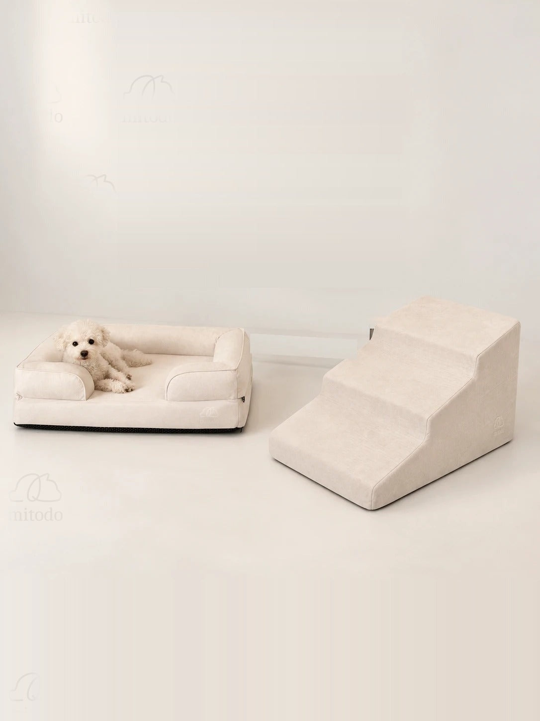 Kumo Bed + Sora Stairs Set in Cream: Kumo orthopaedic bed with a dog resting, Sora pet stairs beside it