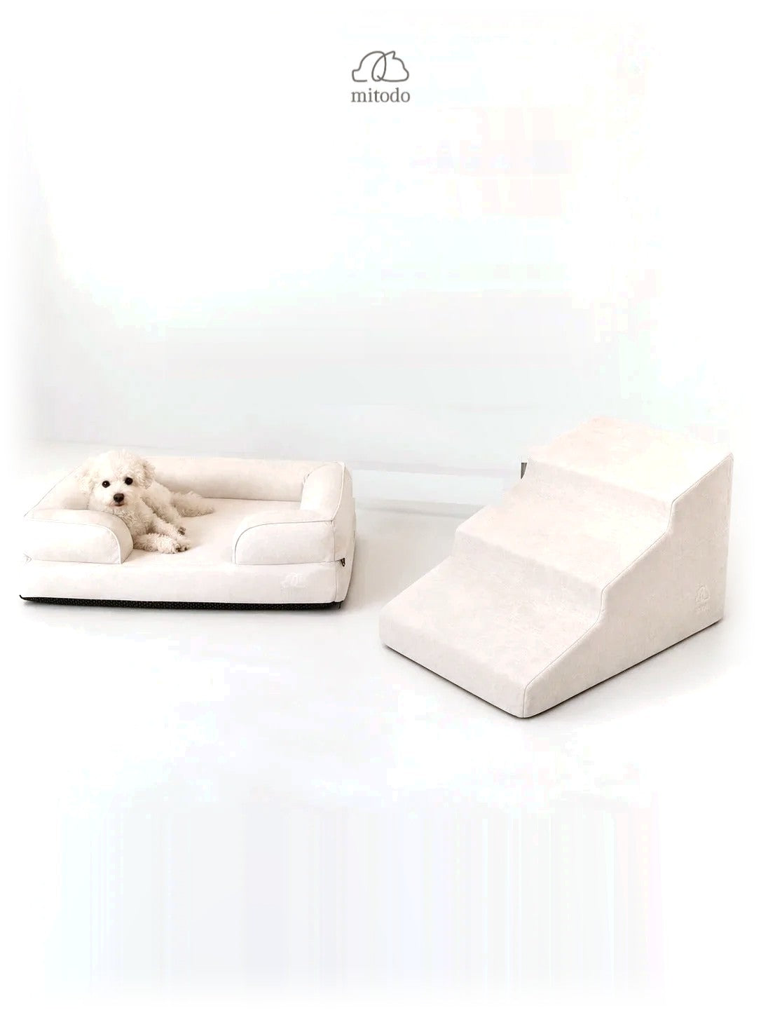 Mitodo Kumo Bed + Sora Stairs Set in Cream: Kumo orthopaedic bed with a dog resting, Sora pet stairs beside it