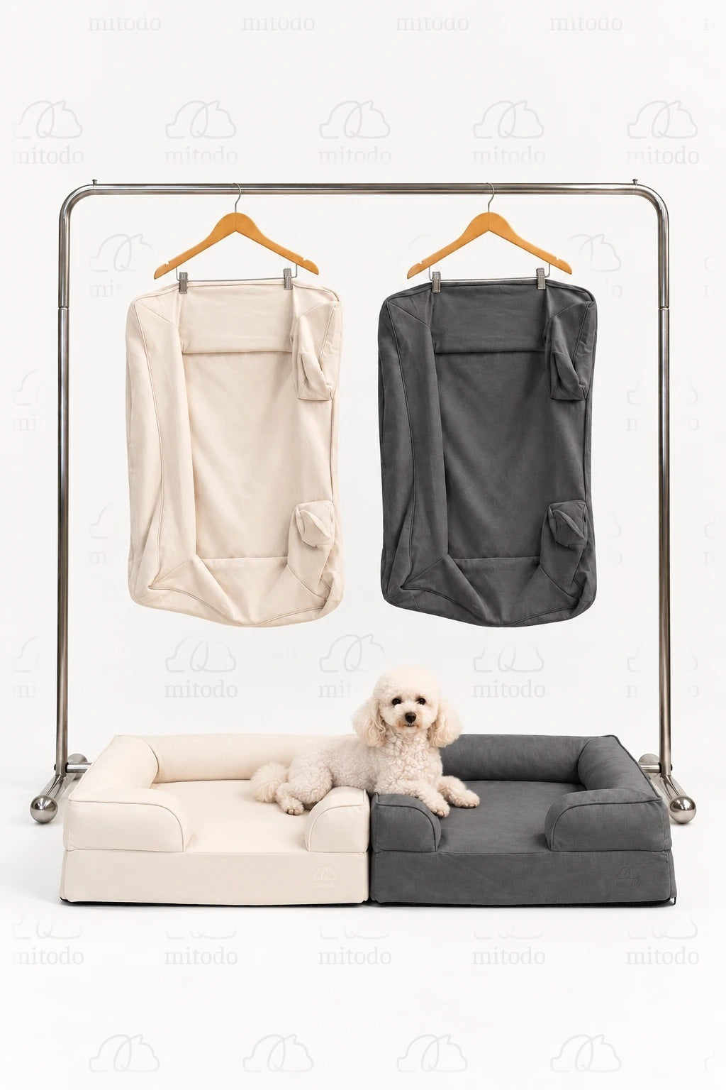Kumo Bed + Spare Cover Set in both colours: two Kumo beds side by side with matching spare covers hanging on a rail, and a white poodle lying across the beds