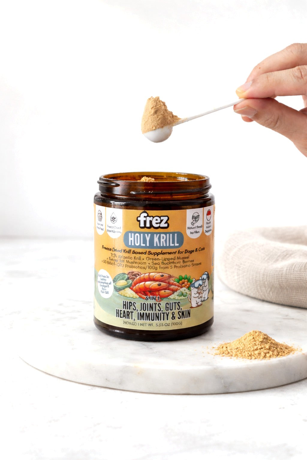 Frez Holy Krill supplement jar with a scoop of krill powder