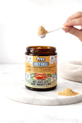 Frez Holy Krill supplement jar with a scoop of krill powder