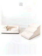 Mitodo Kumo Bed + Sora Stairs Set in Cream: Kumo orthopaedic bed with a dog resting, Sora pet stairs beside it