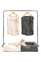 Mitodo Kumo Bed + Spare Cover Set in both colours: two Kumo beds side by side with matching spare covers hanging on a rail, and a white poodle lying across the beds