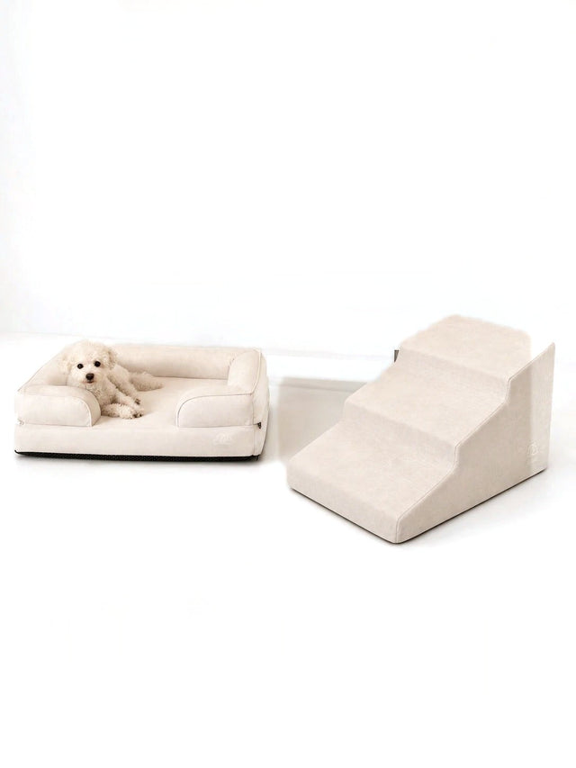 Kumo bed and Sora stairs in Cream with a white poodle